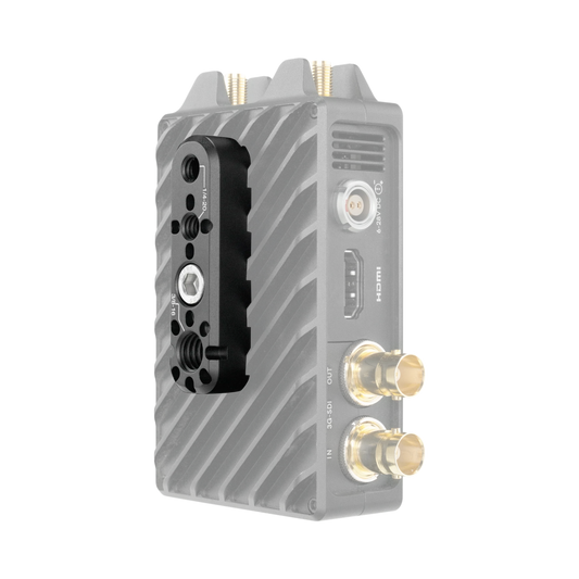A compact electronic device with a ribbed gray body, a black mounting plate on the front, and multiple gold-plated connectors, shown on a plain white background.