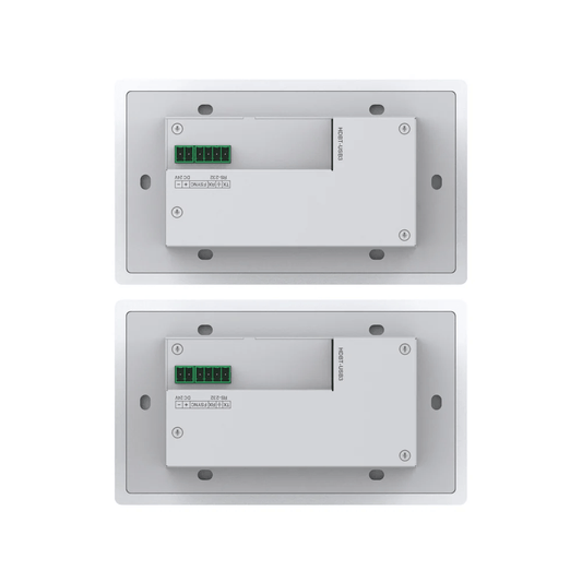 Two metallic wall-mounted devices with green indicator lights on a white background