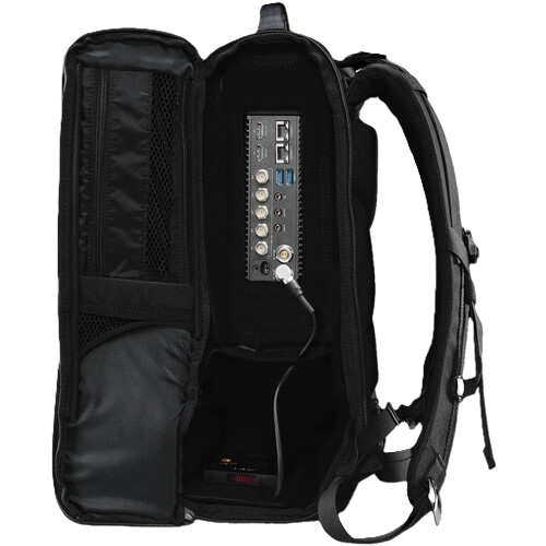 An open black Teradek Prism backpack shown from the inside, revealing a built-in multi-port power bank or charging station with USB-A, USB-C, and other connectors on the back panel.
