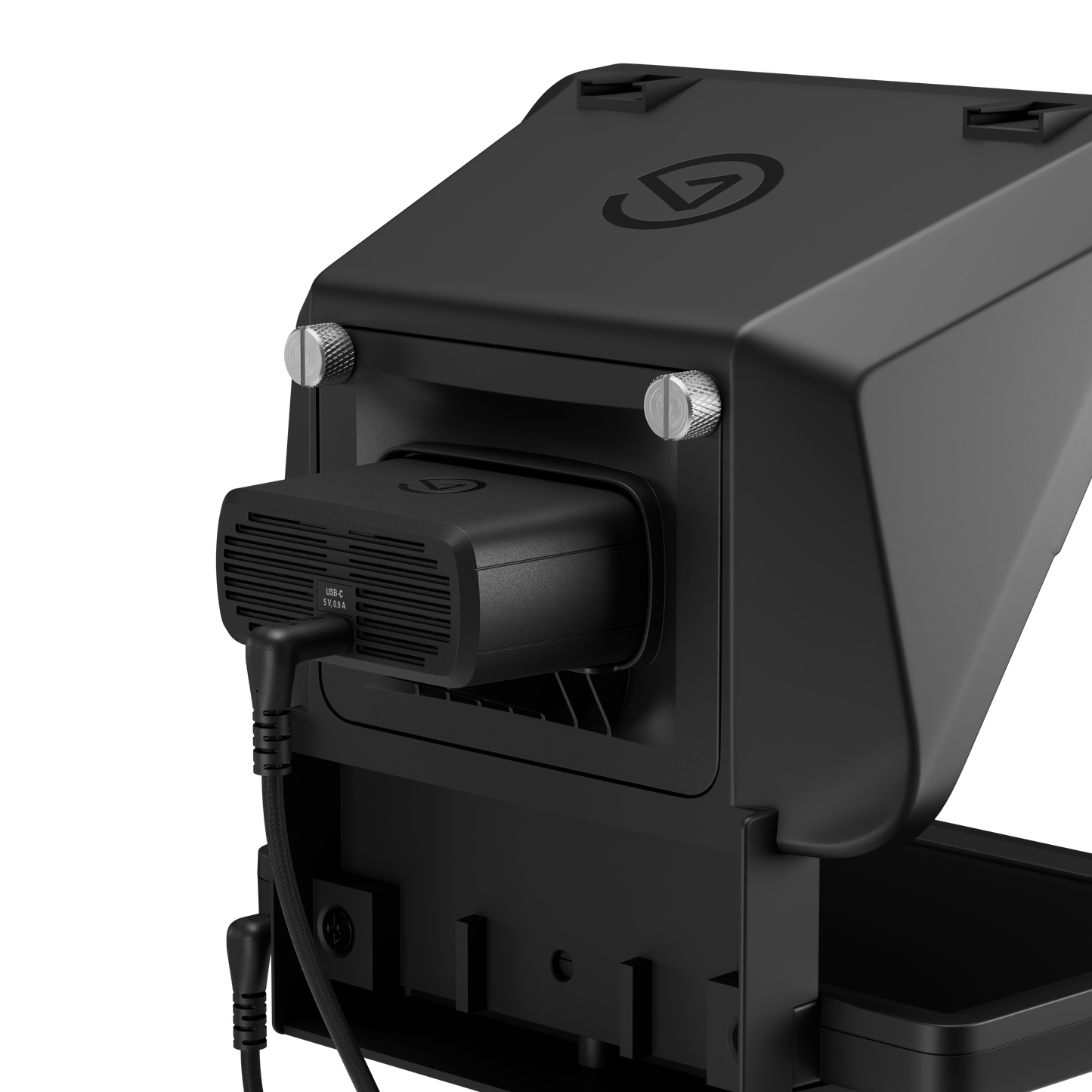 Close-up of a black Webcam in teleprompter electronic device with a vented accessory attached to a side port, shown on a clean white background.
