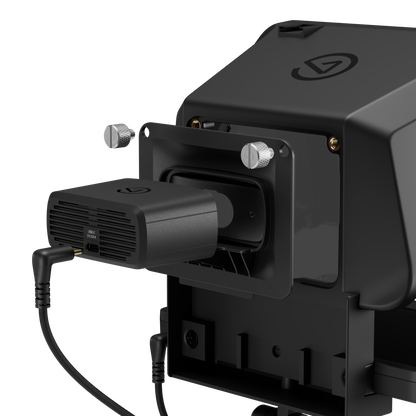 Close-up of a black webcam in teleprompter electronic device with a vented accessory attached to a side port, shown on a clean white background.