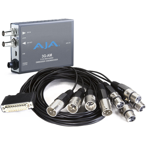 A 3G-AM 8-channel audio receiver/monitor device in gray with blue AJA branding, shown with multiple black multi-pin cables and XLR connectors on a white background.