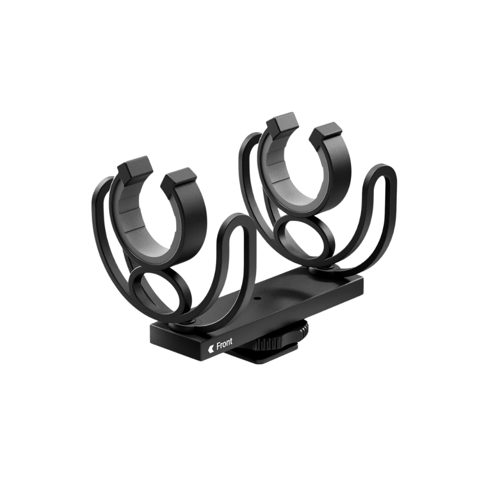 Black guitar capo stand on a white background