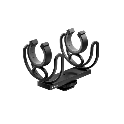 Black guitar capo stand on a white background