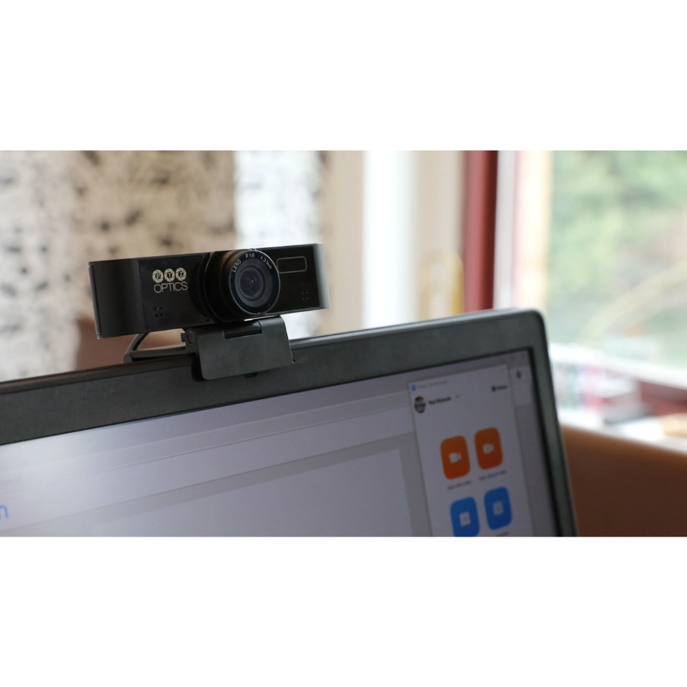 Webcam on a laptop screen with a blurred indoor background