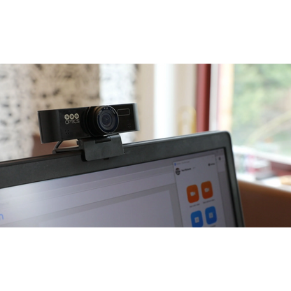 Webcam on a laptop screen with a blurred indoor background