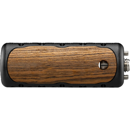 Wooden handle with black metal accents on a white background