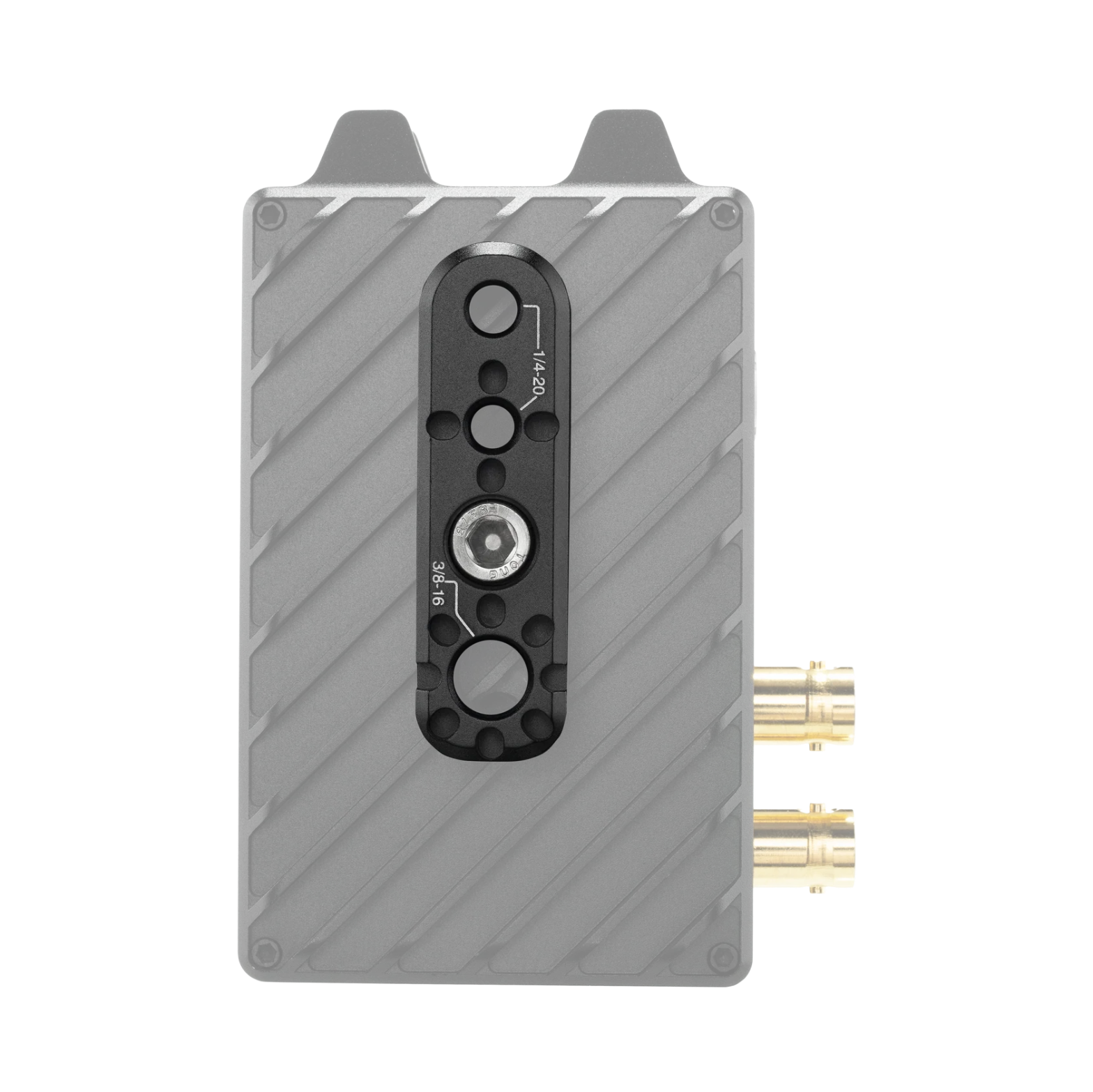 A gray rectangular electronic device with diagonal textured panels, a black central control port, and two gold-toned connector plugs on the right side, shown on a plain white background.