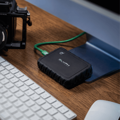 Atom EX80 High-Intensity USB4 80Gbps Portable SSD w/ Location Track on Desk