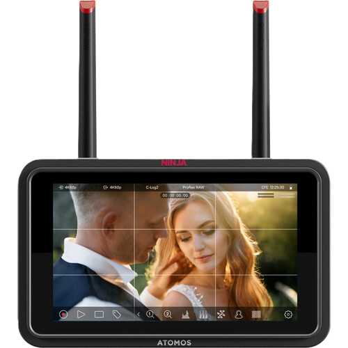 ATOMOS NINJA TX GO video monitor displaying a couple in an outdoor setting with antennas on top.