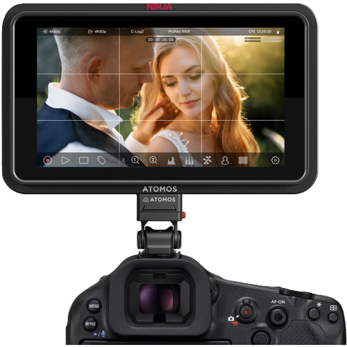 Camera with Atomos Ninja TX GO display showing a couple in an outdoor setting