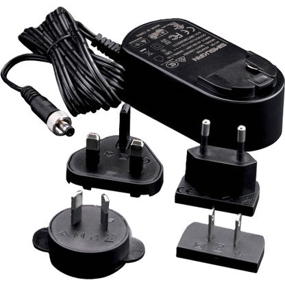 Set of black electrical adapters and a power cable on a white background