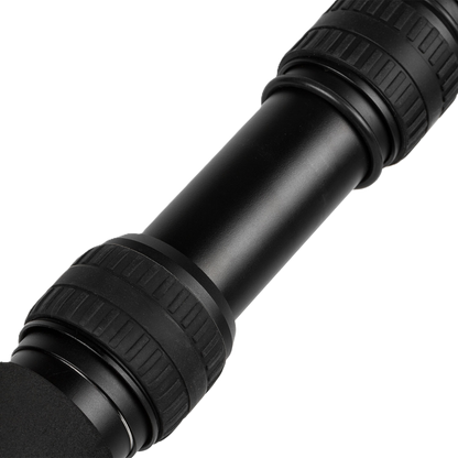 Close-up of a black telescope on a white background