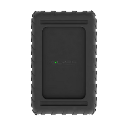 A black rugged external hard drive enclosure with a textured rubber bumper and a recessed center panel featuring the 'GLYPH' logo, shown on a plain white background.