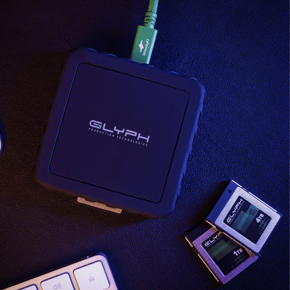 Glyph Capture+ CFexpress Type B USB4 Memory Card Reader with CFexpress memory cards on desk