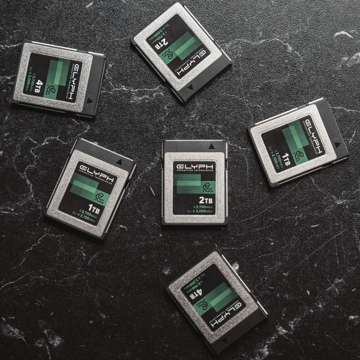 Glyph CFexpress memory cards on a textured black surface