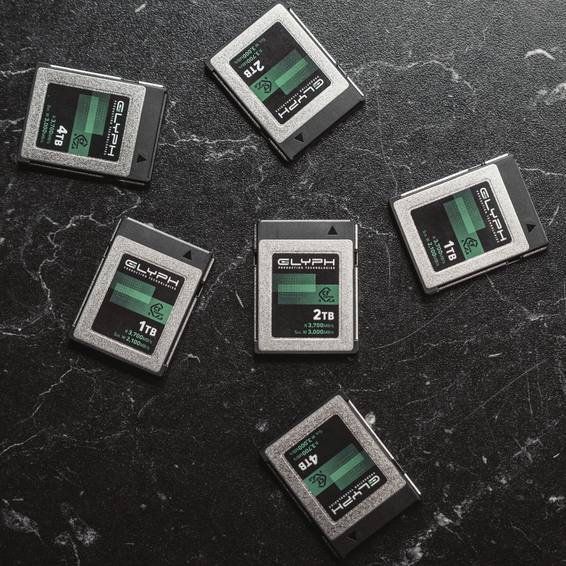 Glyph CFexpress memory cards on a textured black surface
