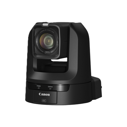 Canon 4K PTZ CR-N100 camera in matte black, featuring a large square lens with a clear glass element, a tilt, pan, and zoom head, and a base with status buttons, shown on a solid white background.