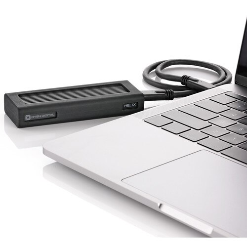 Helix device attached to a laptop on a white background
