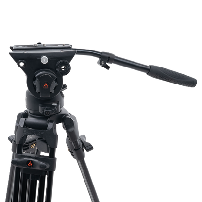 Black video tripod with head on a white background