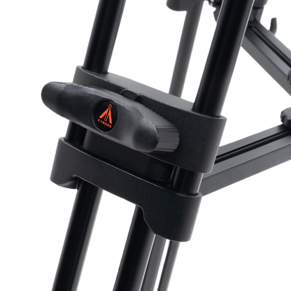 Black tripod with a clamp on a white background