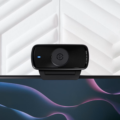 Black webcam on a computer monitor with a white geometric background