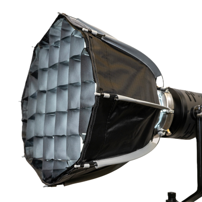 Studio light with honeycomb grid on a white background