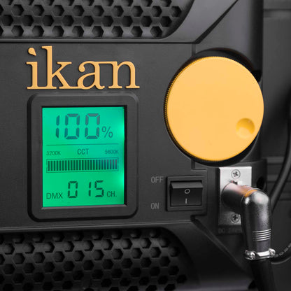 ikan device with digital display and yellow circular component on a black textured background