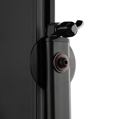 Close-up of a black camera lens with a white background