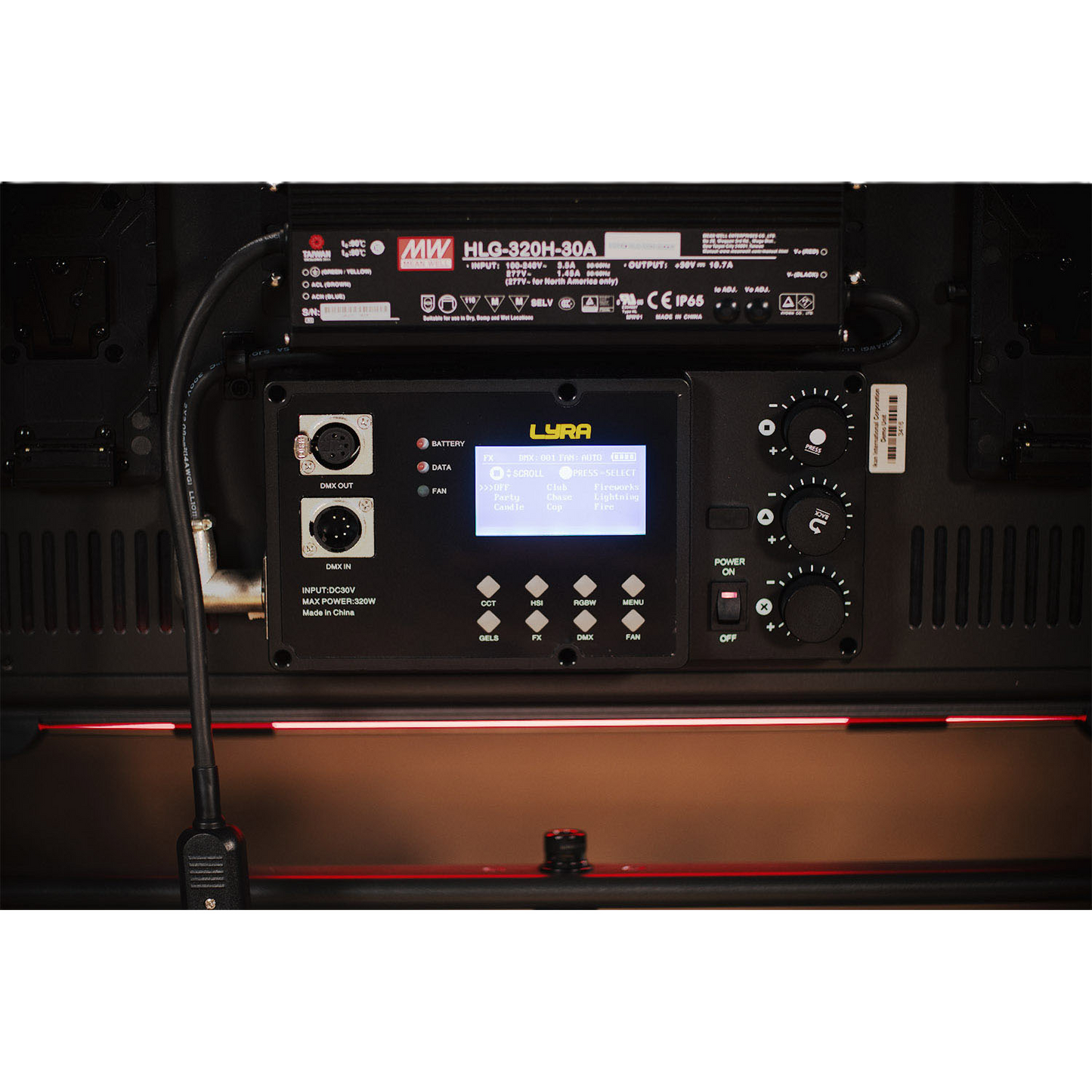 Control panel with digital display and various buttons on a dark background