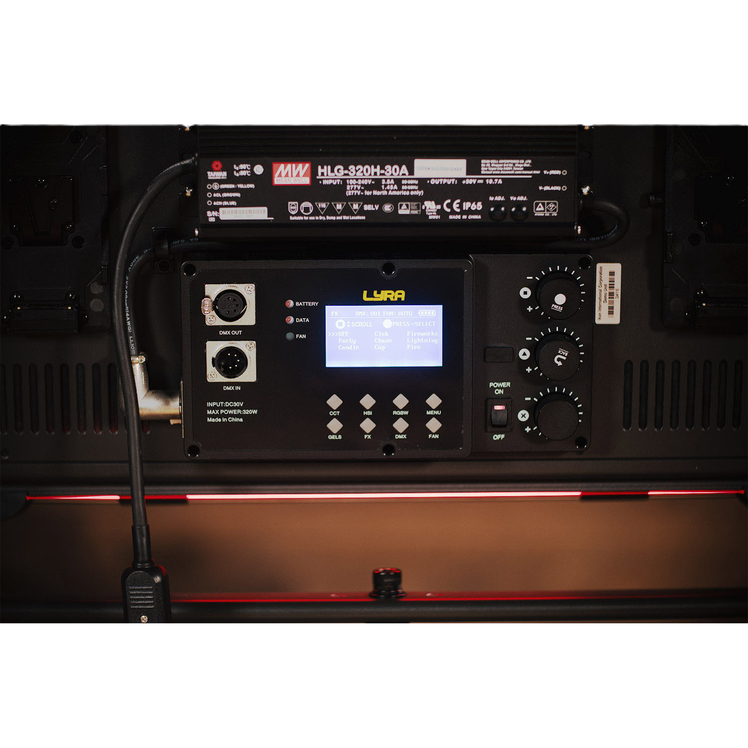 Control panel with digital display and various buttons on a dark background