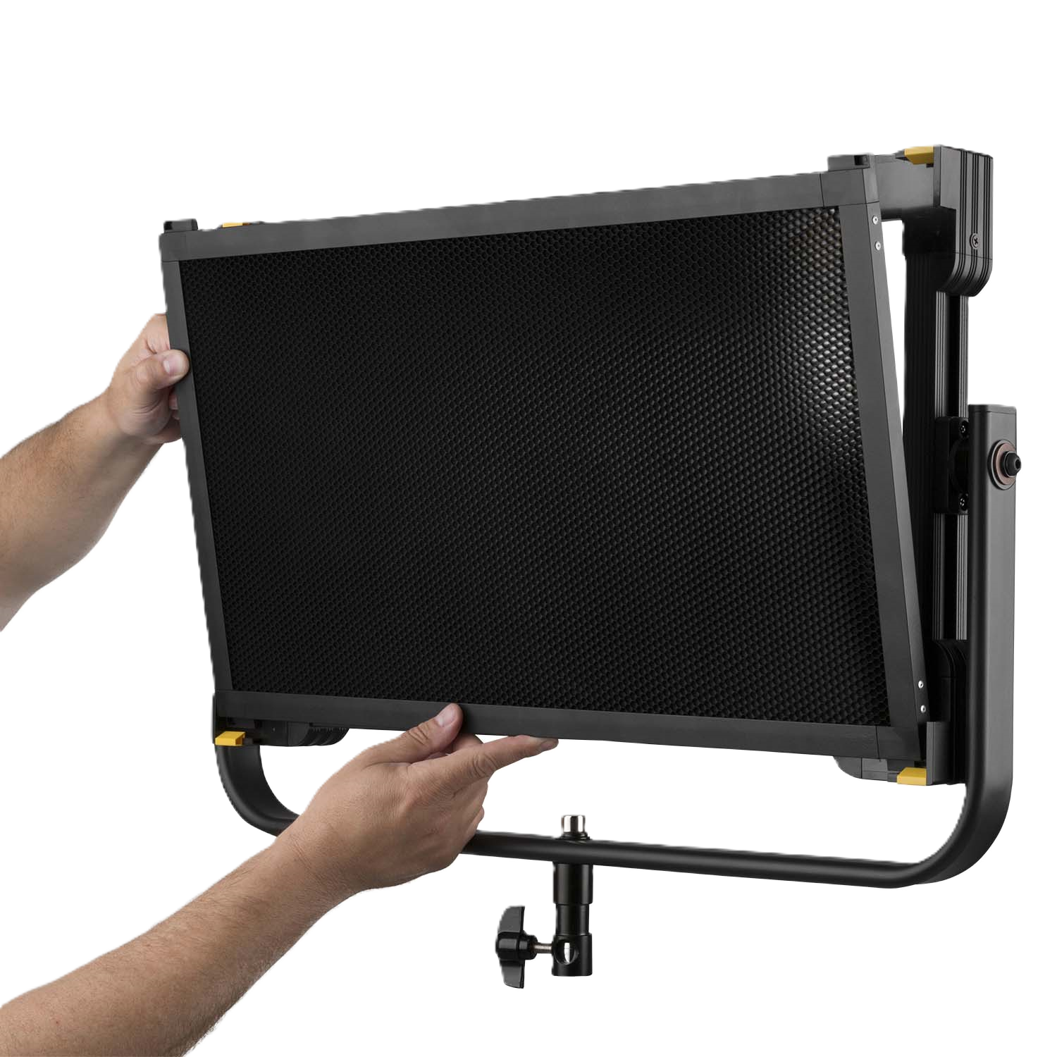 Person holding a large black screen with a grid pattern on a white background