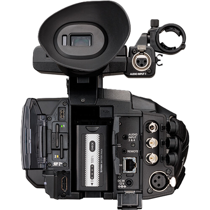Back view of a professional video camera on a white background