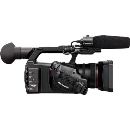Black video camera with microphone on a white background