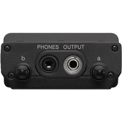Black audio interface with phone output on a white background