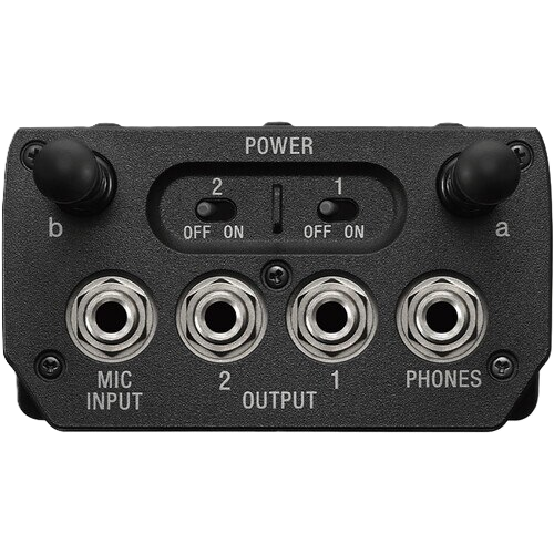 Black audio interface with power switch, input/output ports, and labels on a white background