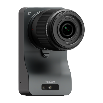 Black camera with lens on a gray base, branded 'YoloCam', on a white background